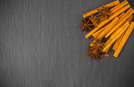 Mulled wine ingredients spices. Anise, cinnamon, cardamom on stone table.の写真素材