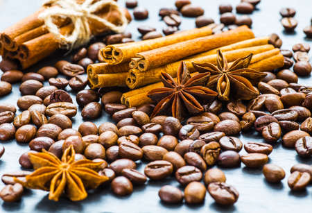 Coffee beans with cinnamon and anise on the sackcloth.の写真素材