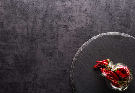 Vegetables. Peppers, tomatoes, garlic, onions on a black backgroundの写真素材