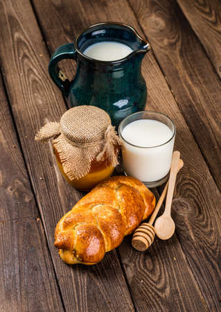 Assortment of baked bread on wooden table backgroundの写真素材