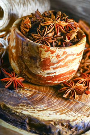 Anis in bowl, dark backgroundの写真素材