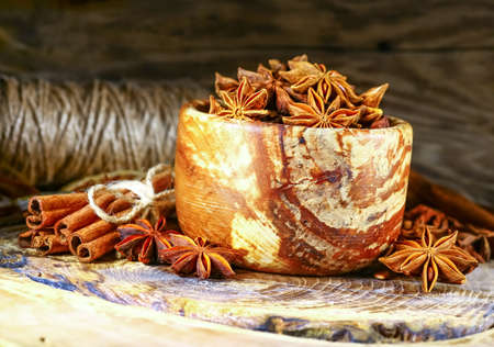 Anis in bowl, dark backgroundの写真素材