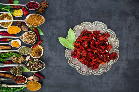 Various spices spoons on stone table. Top view .の写真素材