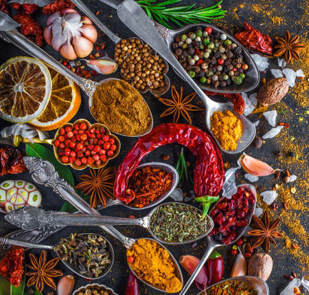 Spices and herbs in metal bowls. Food and cuisine ingredients. Colorful natural additives.の写真素材