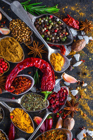 Spices and herbs in metal bowls. Food and cuisine ingredients. Colorful natural additives.の写真素材