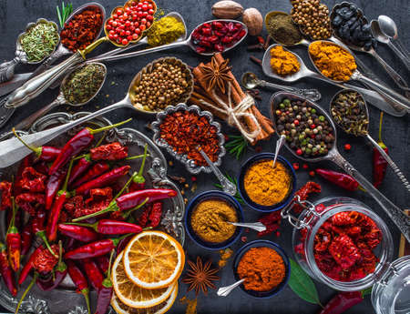 Spices and herbs in metal bowls. Food and cuisine ingredients. Colorful natural additives.の写真素材