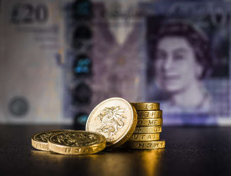British coins stack on black, pound sterlingの写真素材