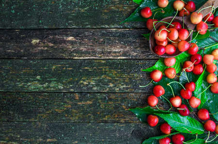 Fresh cherry  on wooden backgroundの写真素材