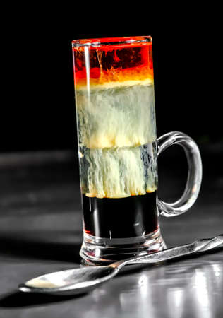 Multi-layered cocktail on bar