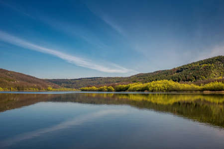river landscape. Photo from the boat. A lot of sky. Blue sky with clouds. Greenish waves. Summer. the Dniester Riverの写真素材