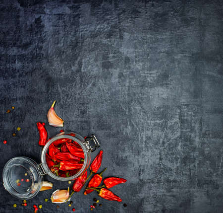 A set of fragrant spices. A mixture of black and red pepper, coriander, paprika. On Wooden background. Top view. Free space.の写真素材