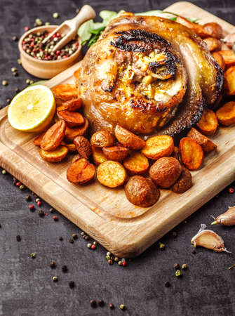 Baked meat on a wooden background.の写真素材