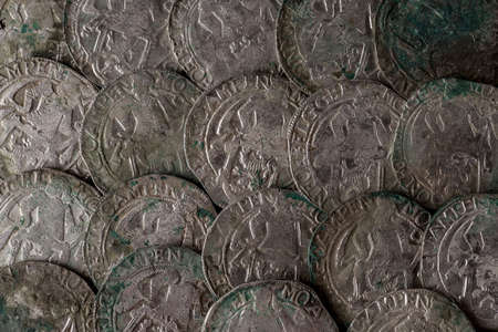 Closeup view of medieval European silver coins. Suitable for an abstract background.の写真素材