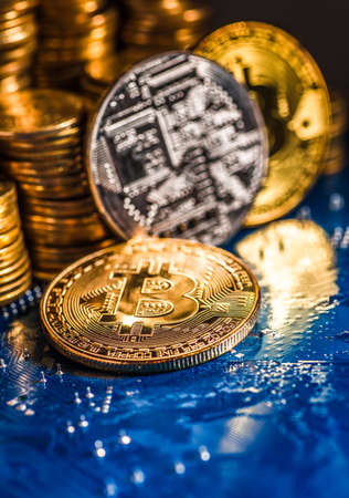 Golden Bitcoin Cryptocurrency on computer circuit board. Macro shotの写真素材