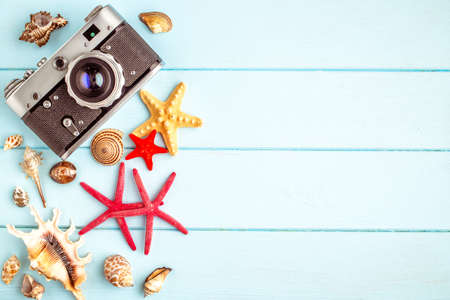 Sea stars and shells on wooden background.Top view travel or vacation concept. Summer backgroundの写真素材