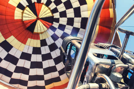 Hot air balloon or aerostat, bright burning fire flame from gas burner equipment, close up from insideの写真素材