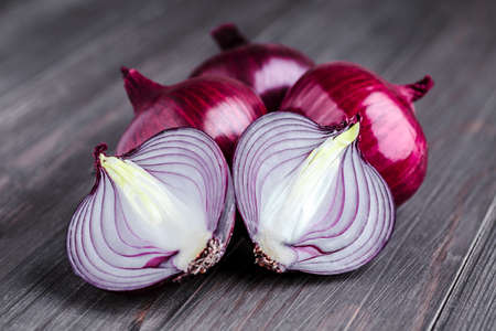 red onions on rustic wood