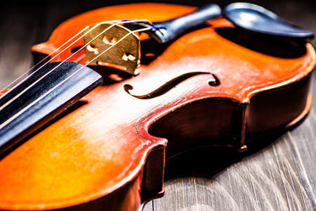 A part of a violin or a viola on a wood backgroundの写真素材