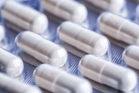 Drug prescription for treatment medication. Pharmaceutical medicament, cure in container for health. Pharmacy theme, capsule pills with medicine antibiotic in packages.の写真素材