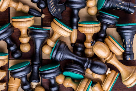 Chess board with wooden chess pieces on the tableの写真素材