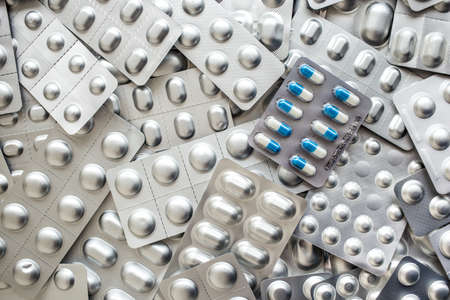 Drug prescription for treatment medication. Pharmaceutical medicament, cure in container for health. Pharmacy theme, capsule pills with medicine antibiotic in packages.の写真素材