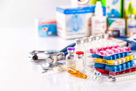 Drug prescription for treatment medication. Pharmaceutical medicament, cure in container for health. Pharmacy theme, capsule pills with medicine antibiotic in packages.の写真素材