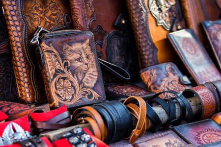Leather goods: bags, purses, purses are on the trading table in the market of handmade products.Top...