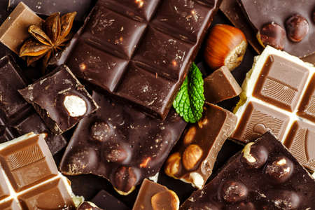 Chocolate on dark stone background. Top view with copy spaceの写真素材