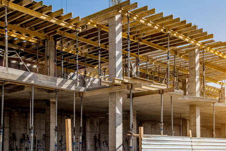 Construction site background. Hoisting cranes and new multi-storey buildings. I.ndustrial...