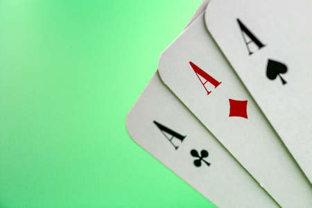 playing cards on a green backgroundの写真素材