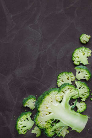 Raw broccoli on black chalkboard.Vegetables for diet and healthy eating.Free healthy vegetarian and...