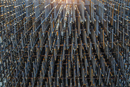 Industrial background. Preparation for pouring concrete. Construction of buildings of reinforced concrete.steel reinforcement bar texture in construction site,Closeup of Steel rebarsの写真素材