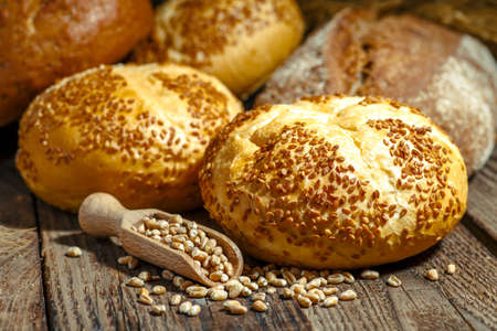 loaf of bread on wooden background, food closeup.Fresh homemade bread.French bread. Bread at leaven. Unleavened bread.Ciabatta bread.の写真素材
