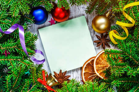 Wide arch shaped Christmas border isolated on white, composed of fresh fir branches and ornaments in...