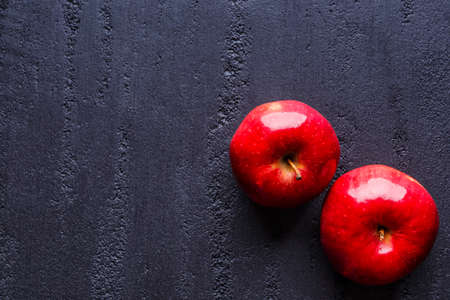 Group of red apples with their leaves. Top view with space for your textの写真素材