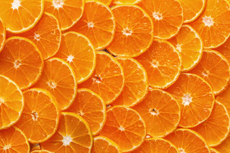 Citrus background. Lemon, orange lime, grapefruit mandarin. Harvest concept. Top view. Tangerine segments, orange background textureの写真素材