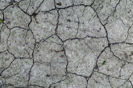 Cobblestone texture.Marble and granite drainage system closeup.Concrete wall with gravel. Gray...