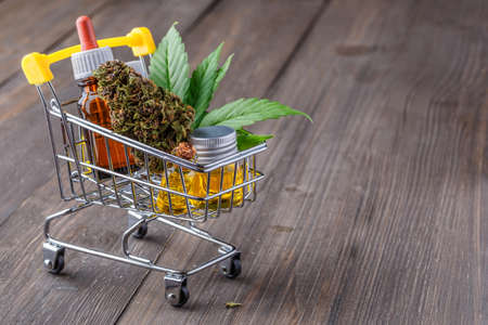 supermarket trolley marijuana medical cannabis oil cbd,cannabis,Essential oil made from medicinal cannabis.Cannabis herb and leaves for treatment.Buds. Skunk. cbdの写真素材