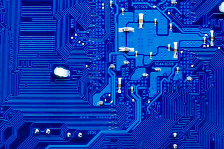 blue circuit board background of computer motherboard, Electronic computer hardware technology.Integrated communication processor. Information engineering component. Blue color.の写真素材