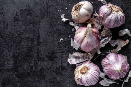 natural food, heads of garlic on a black background. Top view. Copy space.の写真素材