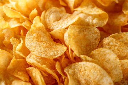 Potato chips or crisps. Potato chips texture background flat overhead view. concept of fast food and snacks. Food background.の写真素材
