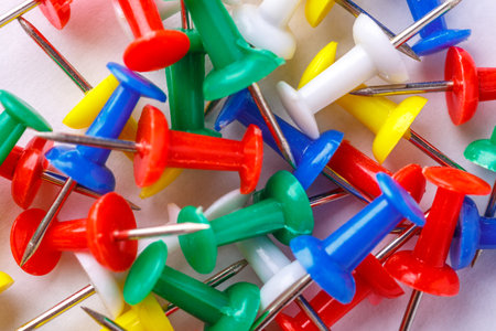 pile of a push pin isolated on white background. Push pins isolated on white background. colorful push-pin thumbtack tools office on white backgroundの写真素材