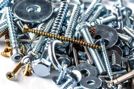 Mixed screws and nails. Industrial background. Home improvement.bolts and nuts.Close-up of various screws. Use for background, top view.の写真素材