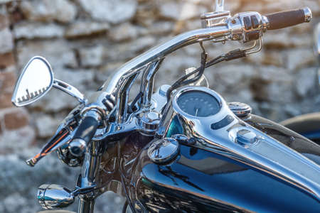 The chromed handlebar of a motorcycle.Travel and freedom, outdoor activities. View of motorcycle...