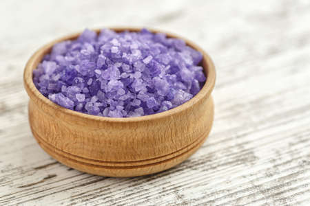 lavender's spa products with dried lavender flowers on a wooden table. Flat lay bath salt and massage oil on wooden background. Skin care, beauty treatment concept. Lavendula oleumの写真素材