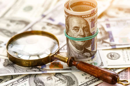 Money american hundred dollar bills.Closeup of assorted American banknotes.US currency scattered on...