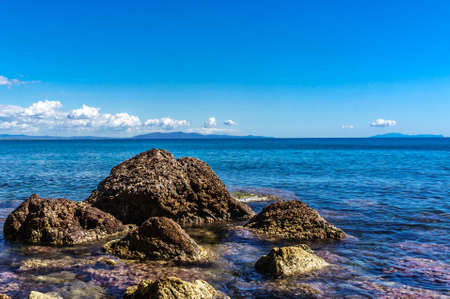 Beautiful rocky landscape.Splendid panoramic view of the crystal blue sea. Mediterranean coast of Cyprus island.Beach with coralsの写真素材