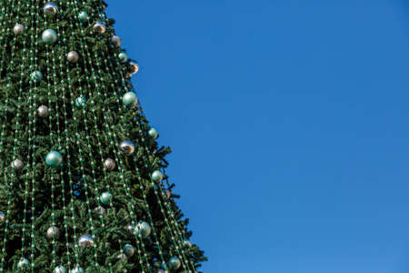 New Year tree at the Christmas market.merry christmas, cute festive decoration close up, beautiful toys for new year. Good New Year spirit.の写真素材
