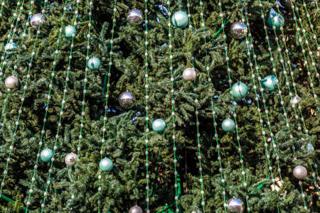 New Year tree at the Christmas market.merry christmas, cute festive decoration close up, beautiful toys for new year. Good New Year spirit.の写真素材