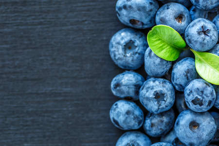 Water drops on ripe sweet blueberry. Fresh blueberries background with copy space for your text. Vegan and vegetarian concept. Macro texture of blueberry berries.Texture blueberry berries close upの写真素材